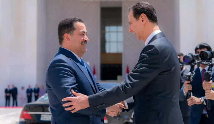 Syria's President Bashar al-Assad greets Iraqi Prime Minister Mohammed Shia al-Sudani