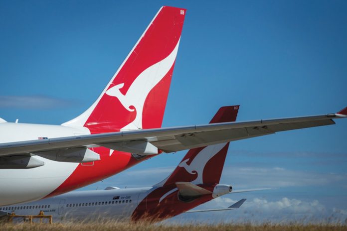 Grounded Quantas Aircraft at Brisbane Airport as Airlines Expected to Lose Over $84 Billion This Year